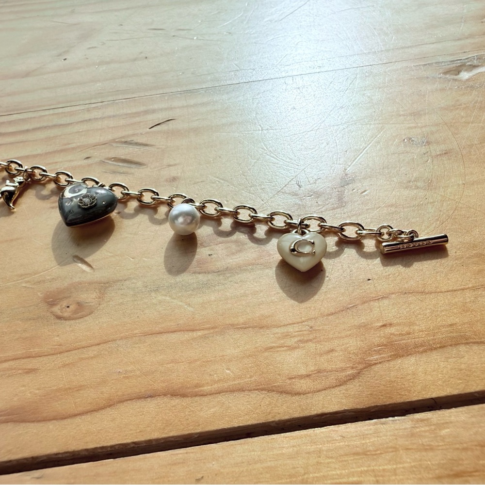 Coach Gold Charm Bracelet with Heart and Pearl Accents - Picture 3 of 5